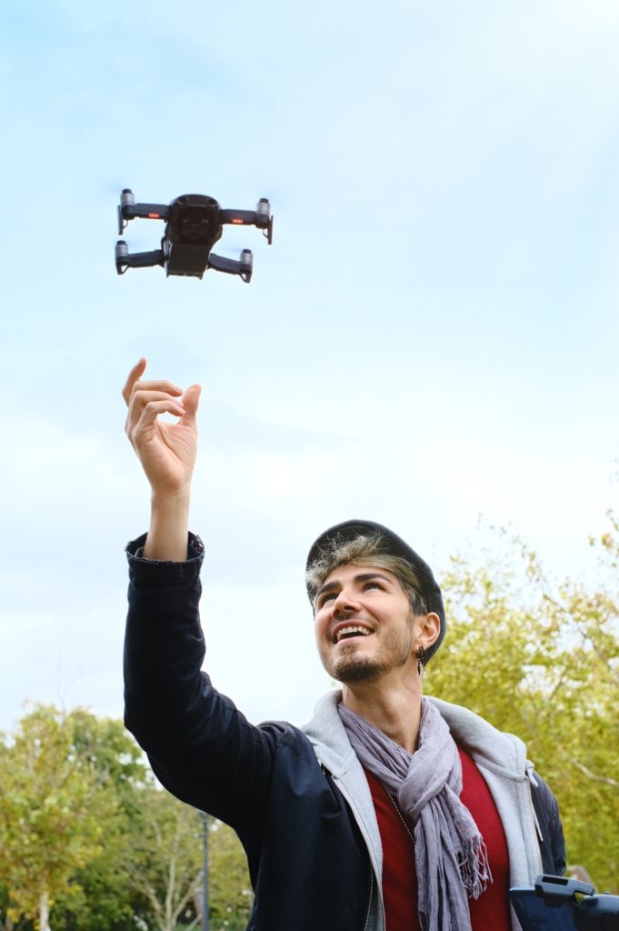 Young Man Flying Drone