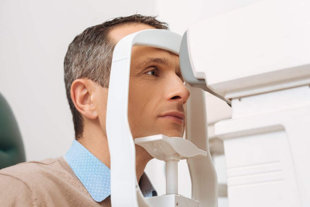 side view of patient getting eye checked in clinic