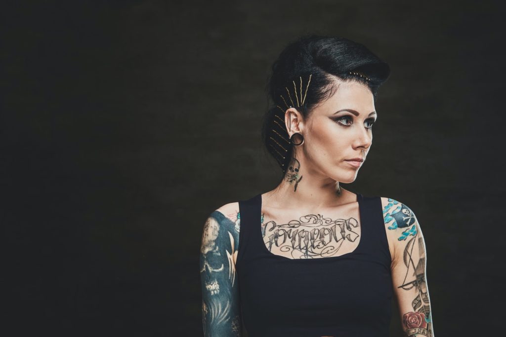 Portrait of young woman with tattooes