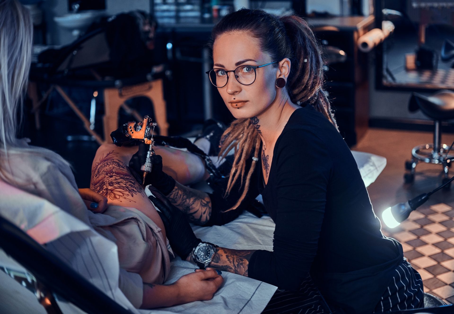 Process of makining new tattoo at tattooing salon