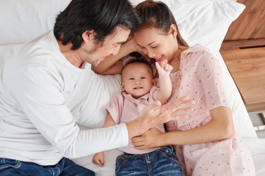 Parents and smiling baby