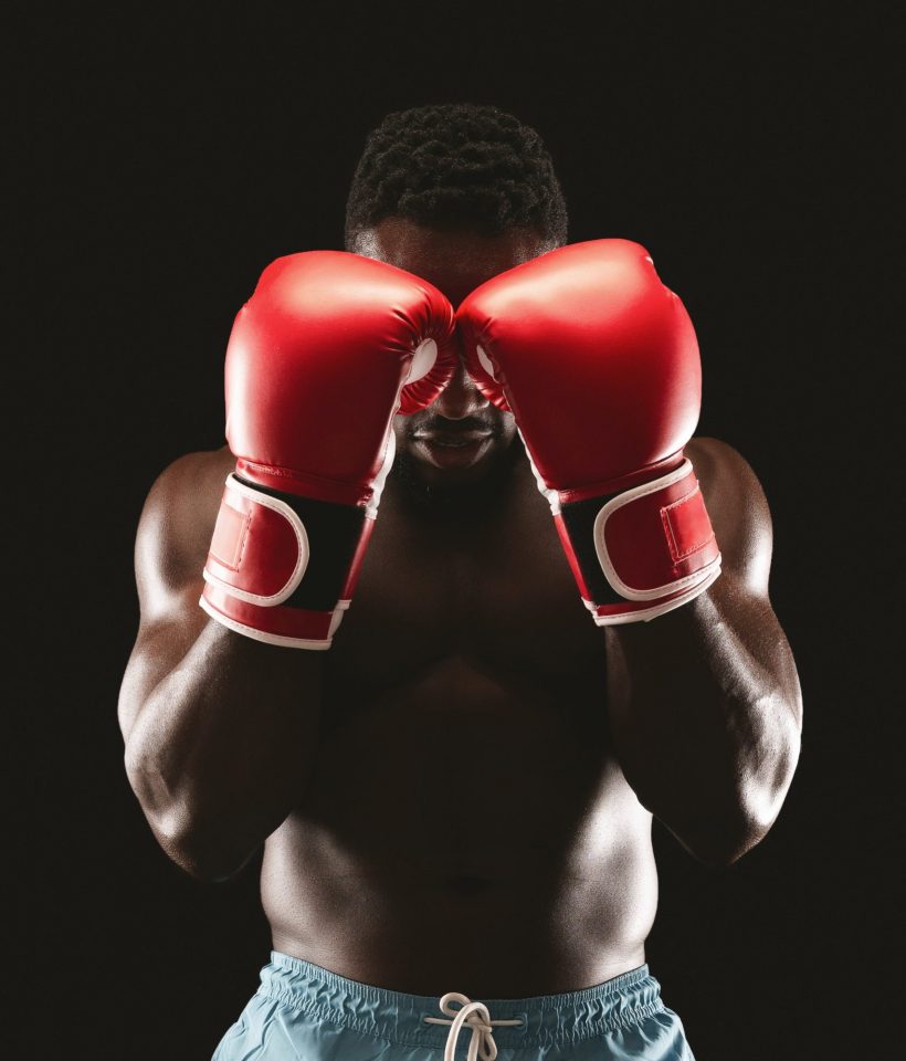 Portrait of professional boxer showing defence pose