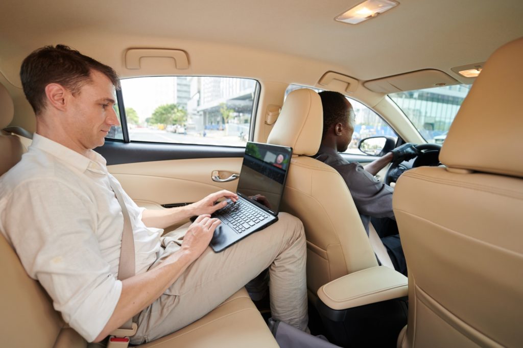 Entrepreneur Riding Taxi to Office