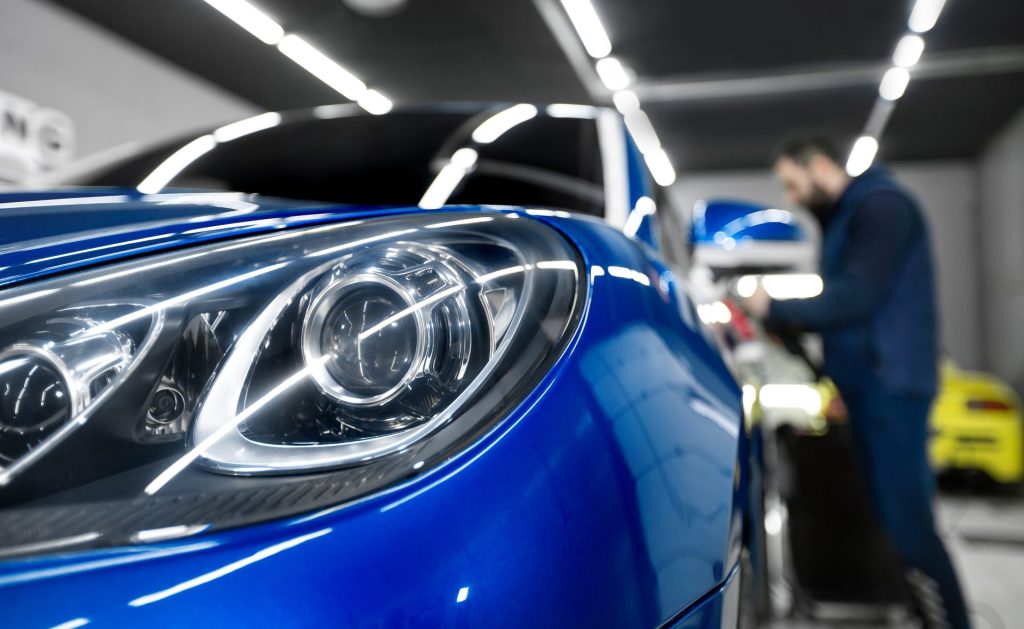 Detailing of the car - Protection of the front headlights with insulating tape.