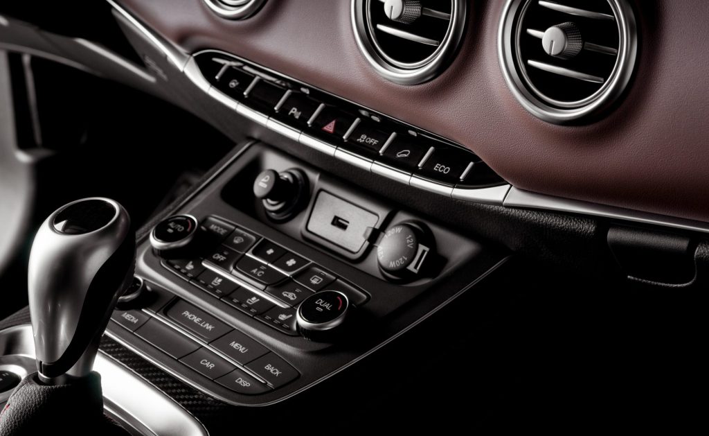 Interior of a new SUV car with control buttons at the cockpit