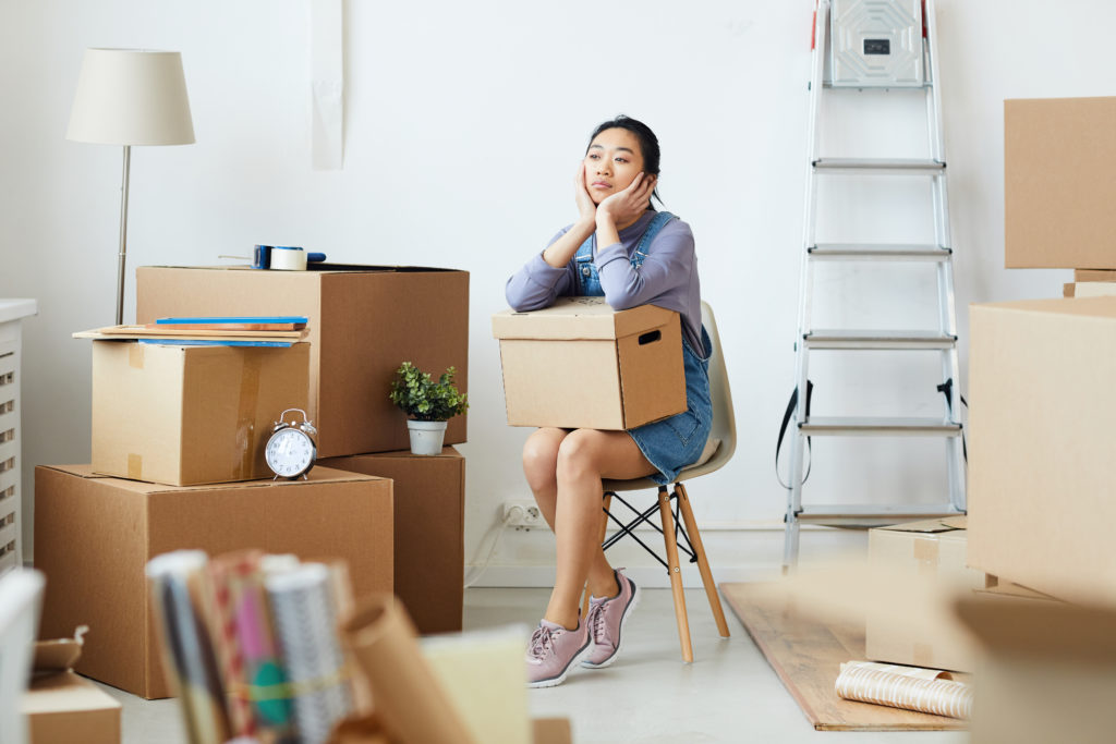 Young Asian Woman Waiting for Moving Crew
