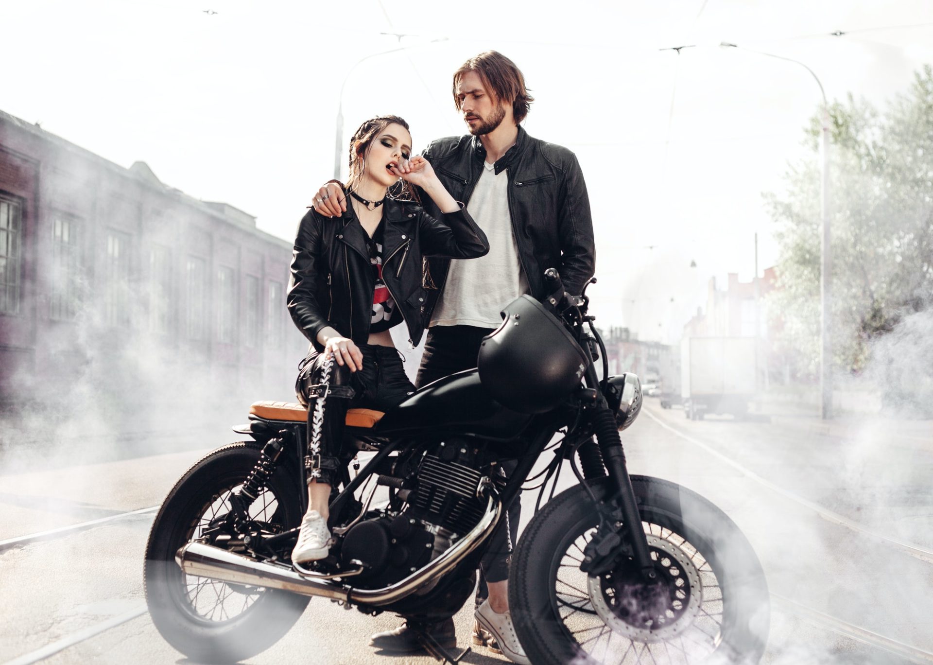 Couple in love and vintage custom motorcycle