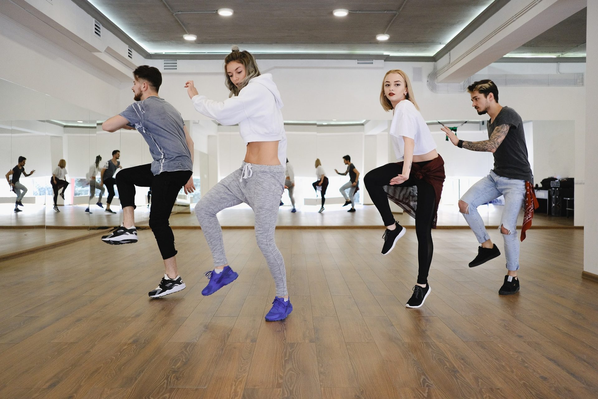 Group of young modern dancers dancing in the studio