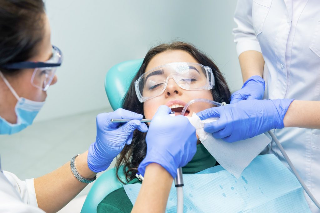 Dentists are working with patient