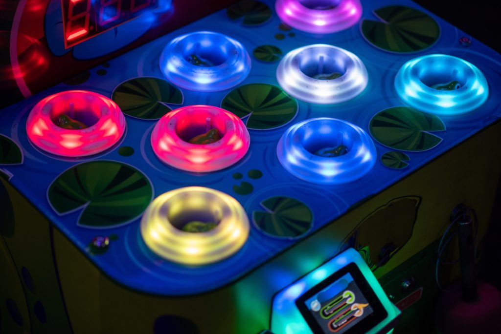 Neon colored circle rings on arcade game