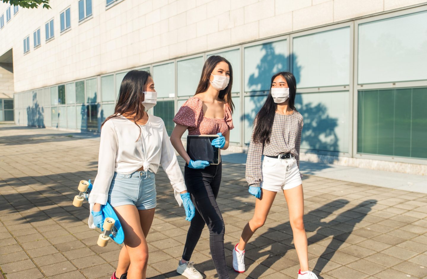 Friends meeting outdoors during pandemic flu