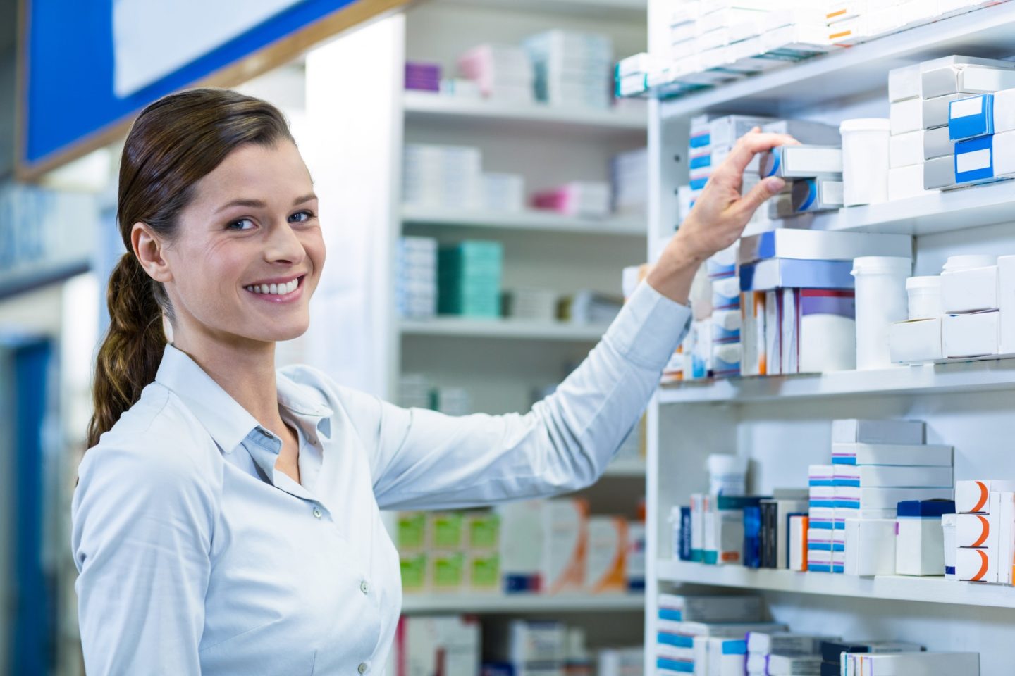 Pharmacist checking a medicine in pharmacy