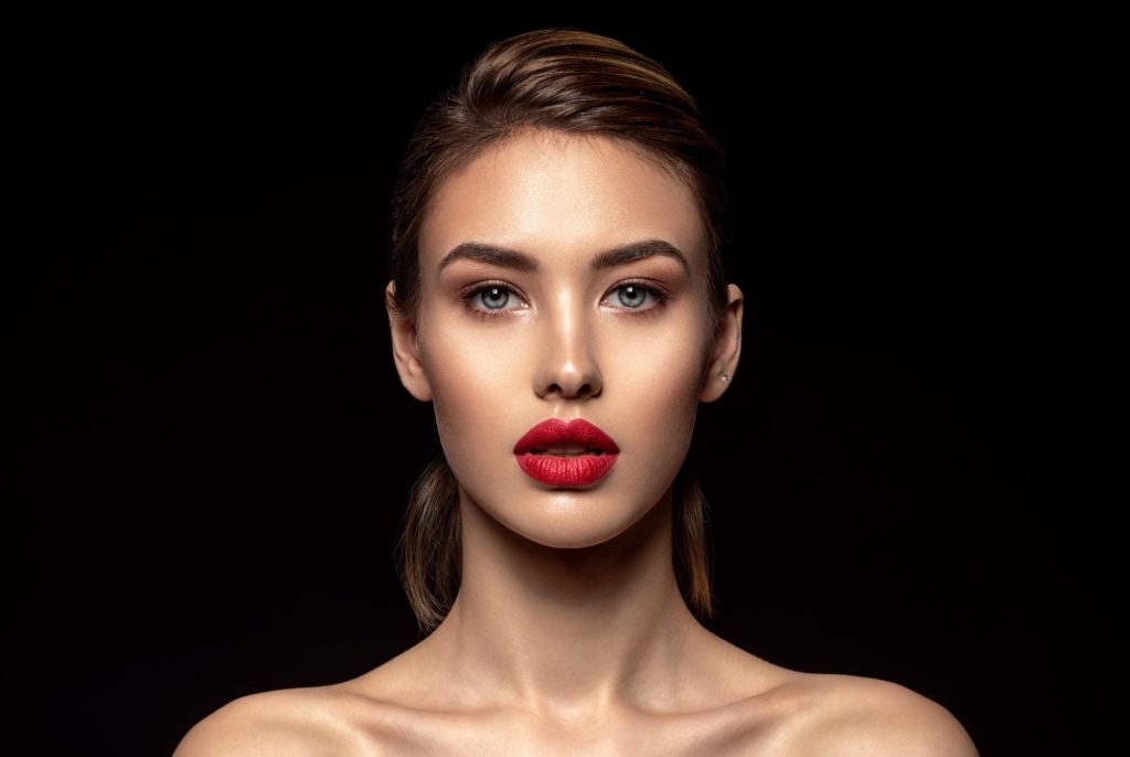 Beautiful fashion woman with red lipstick. Pretty model.