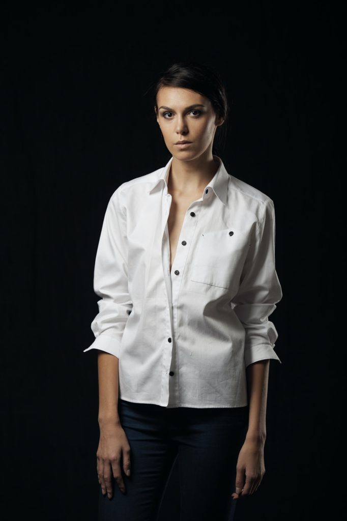 Fashion photo of young magnificent woman in white shirt