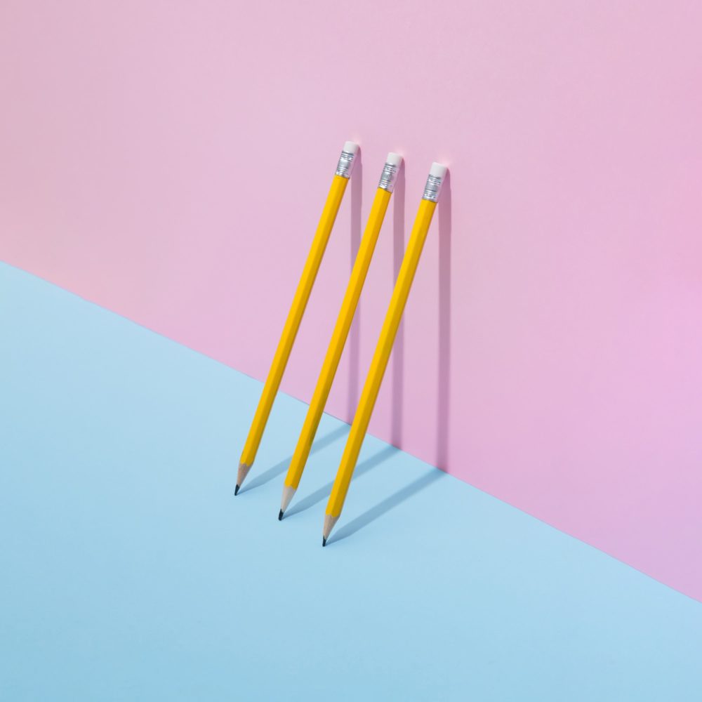 School pencils on pastel background. Minimal concept art.