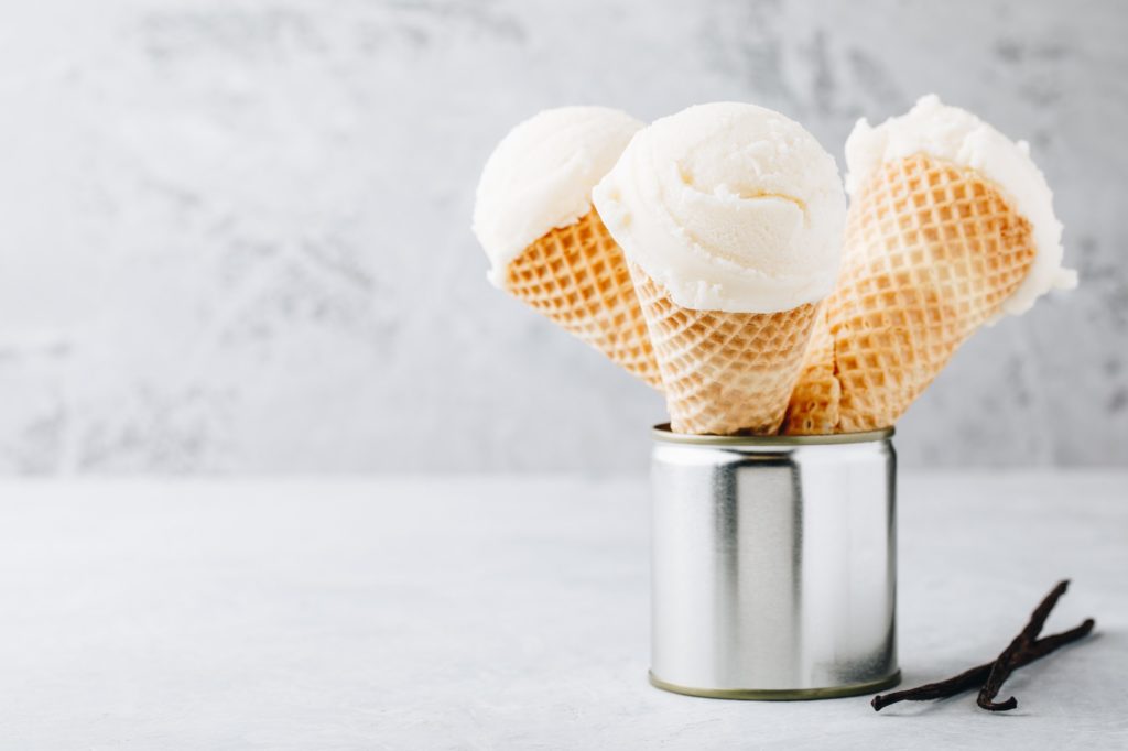 Homemade Vanilla Ice Cream scoop in waffle cones