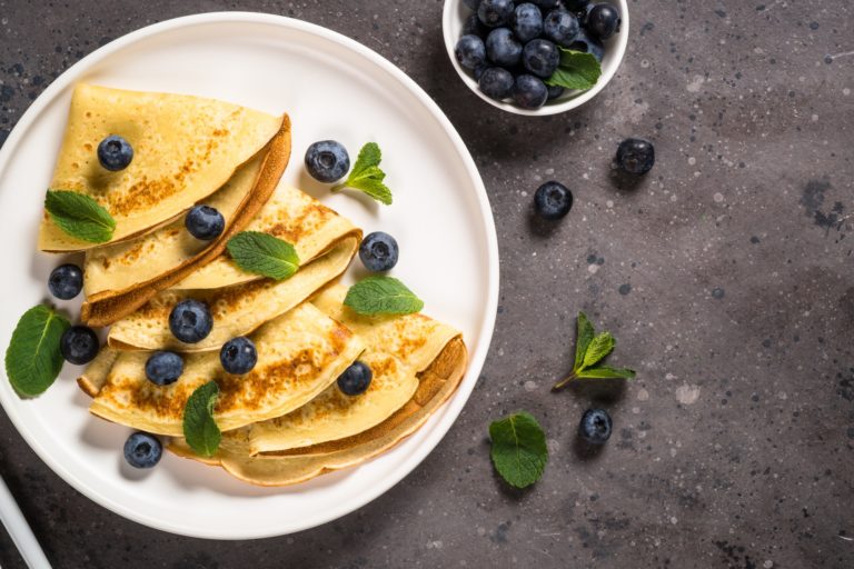 Crepes with blueberries and honey