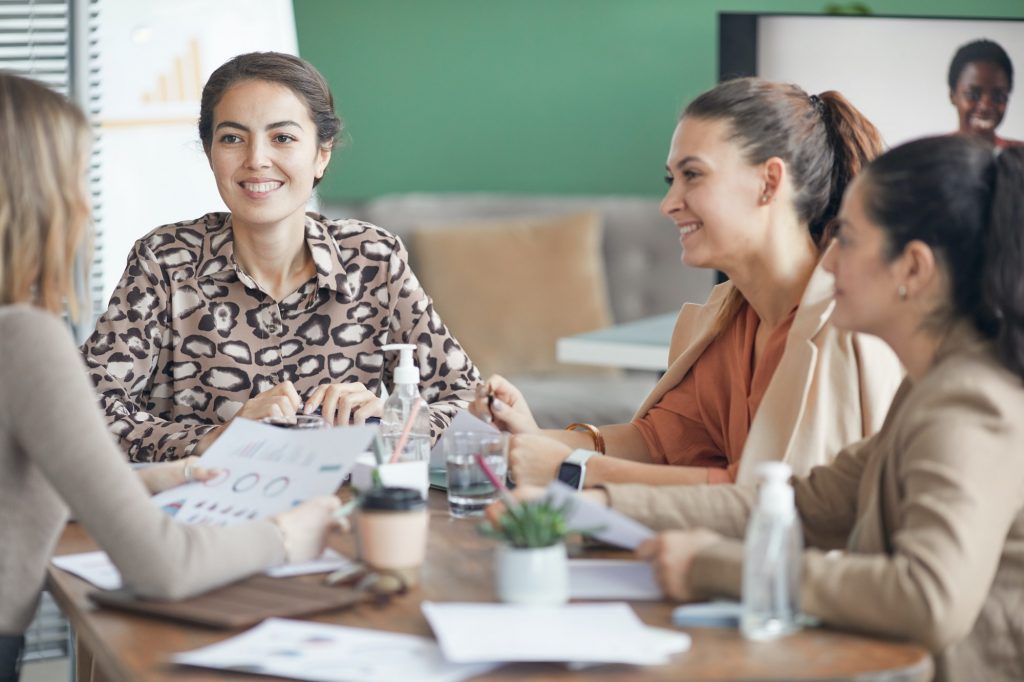 Group of Smiling Women in Business Meeting