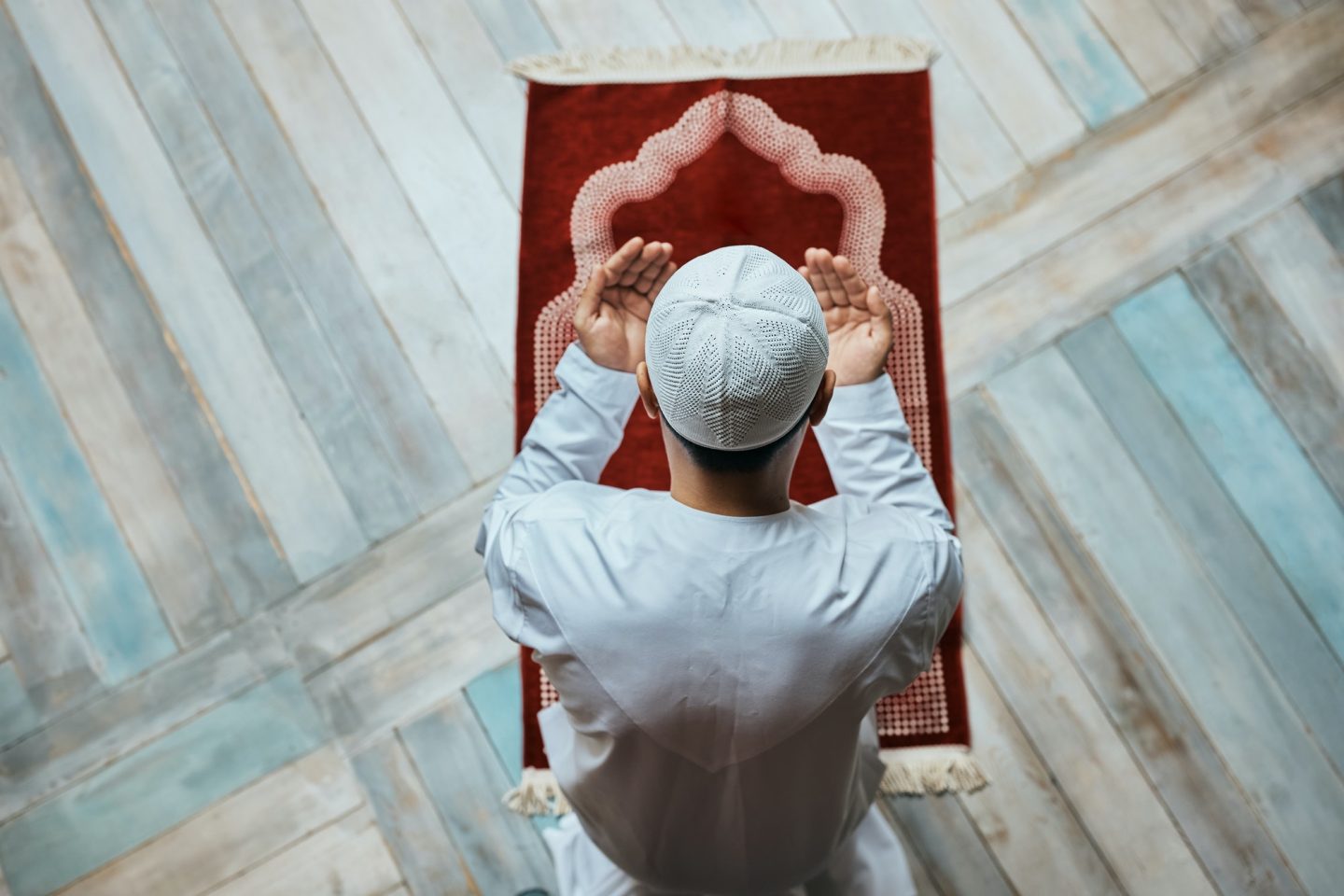 Above view of Muslim in a prayer at mosque.