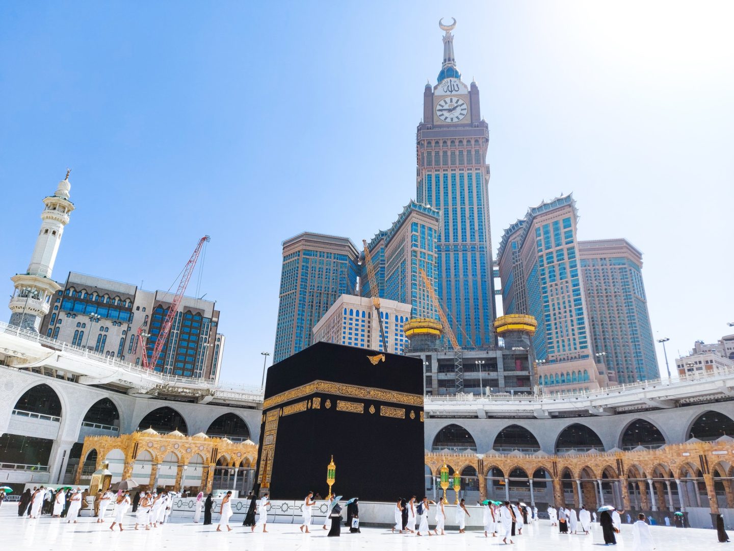 Pilgrims in Kaaba in Macca al Haram - umrah Socially Distanced coronavirus restrictions face mask