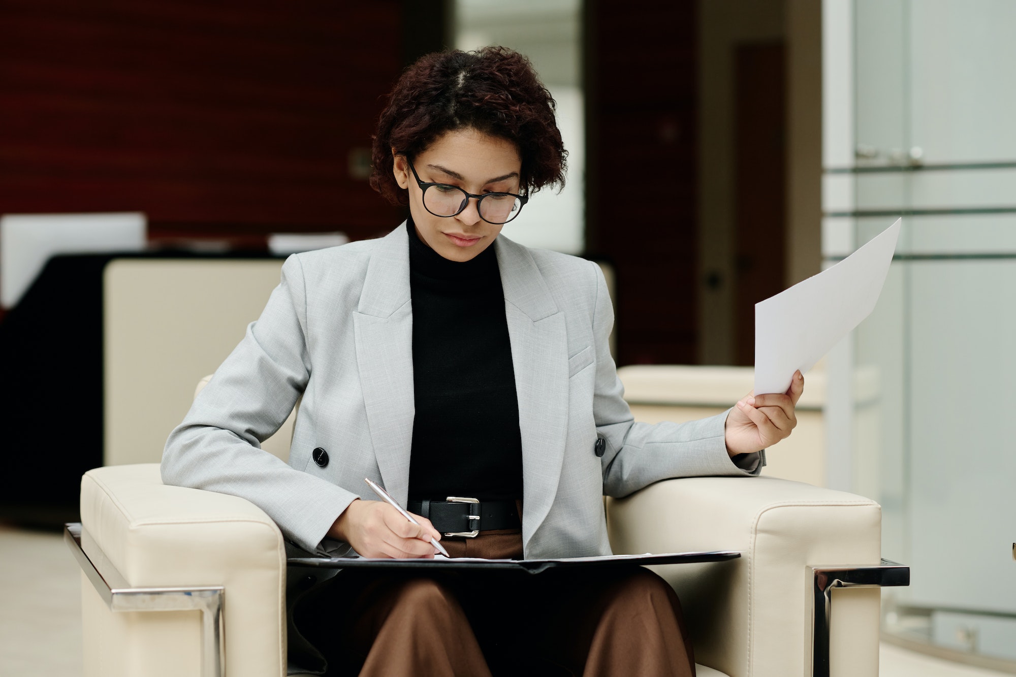 Businesswoman working with documents in office