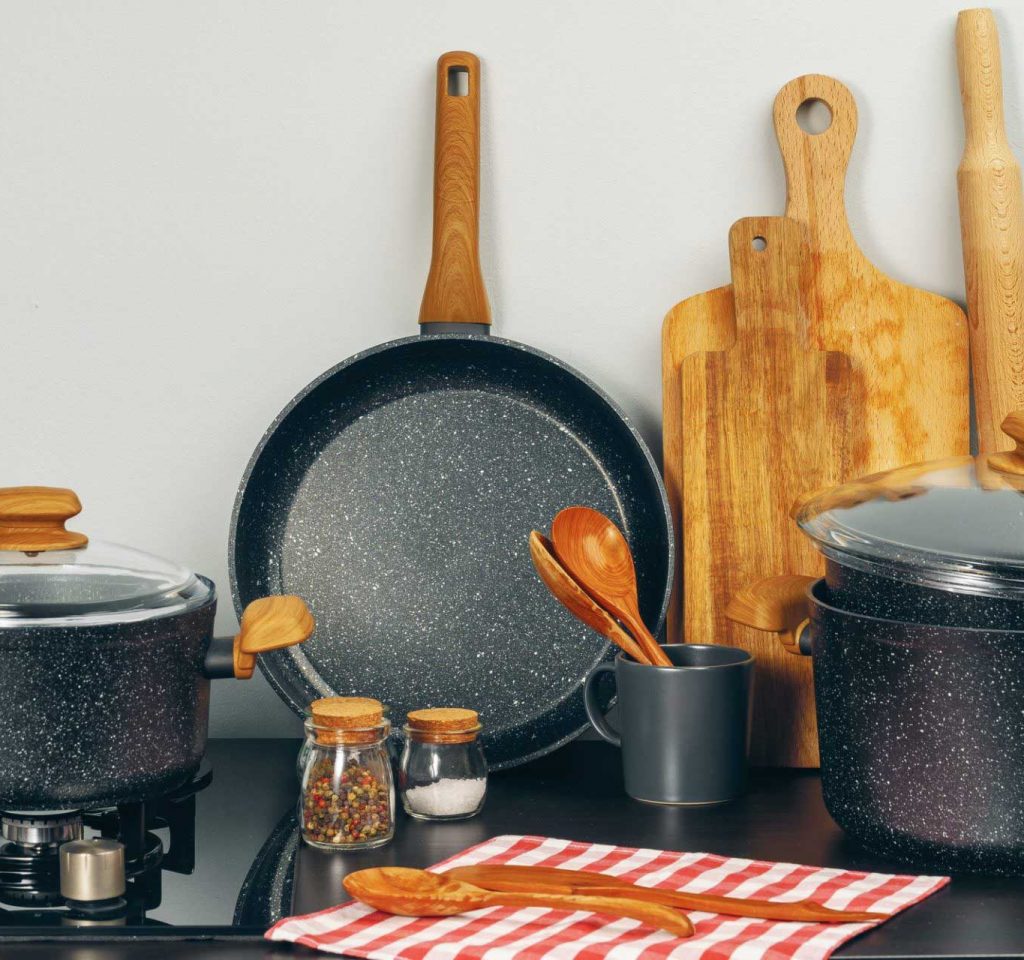Set of cookware utensils on a kitchen counter