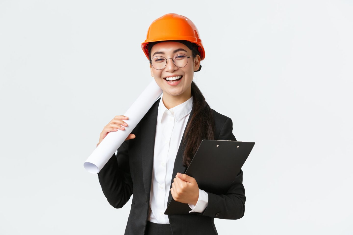Professional happy asian female architect, construction engineer in helmet and business suit holding