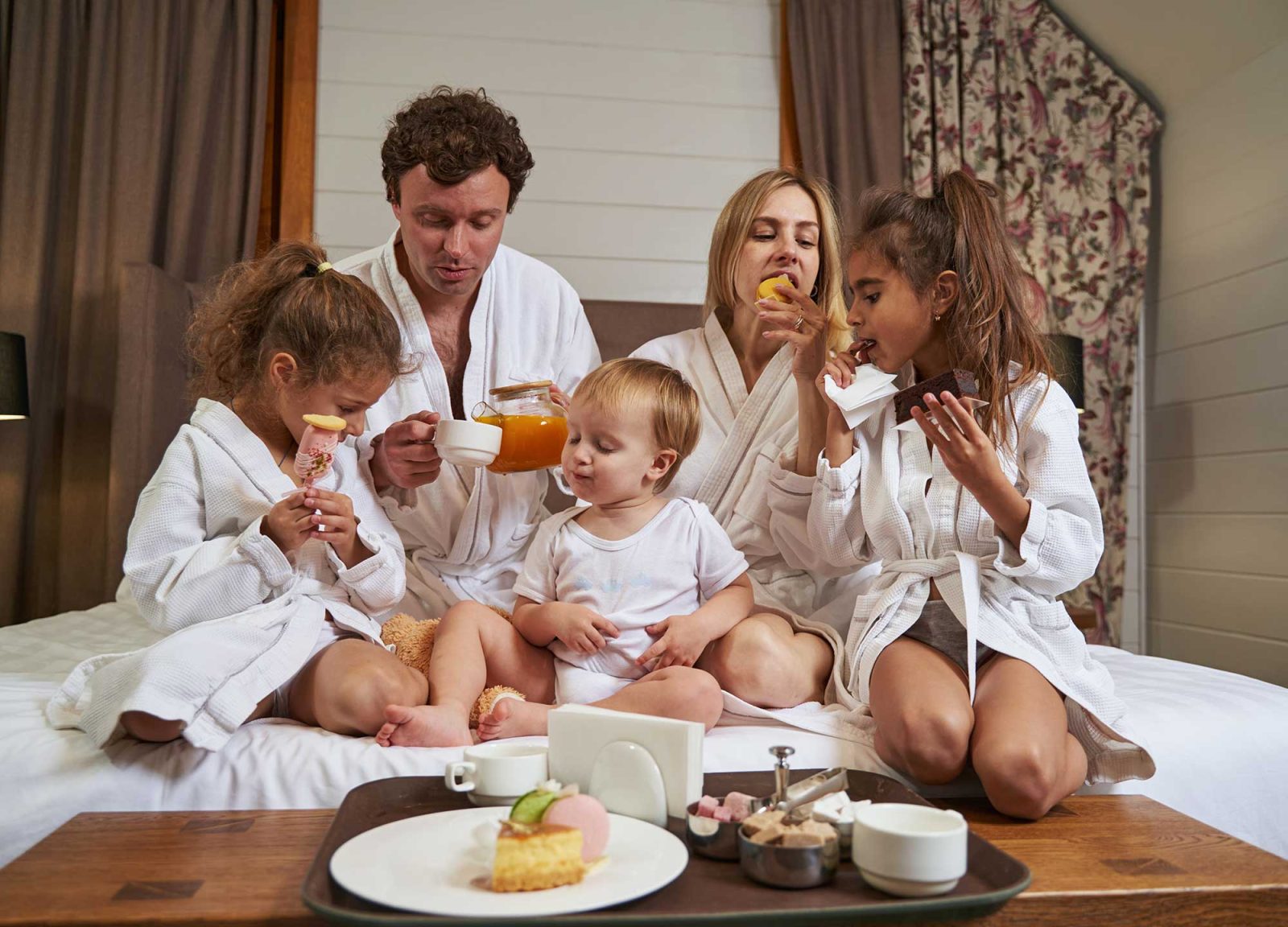 smiling-family-eating-breakfast-in-the-hotel-2022-03-08-23-07-07-utc