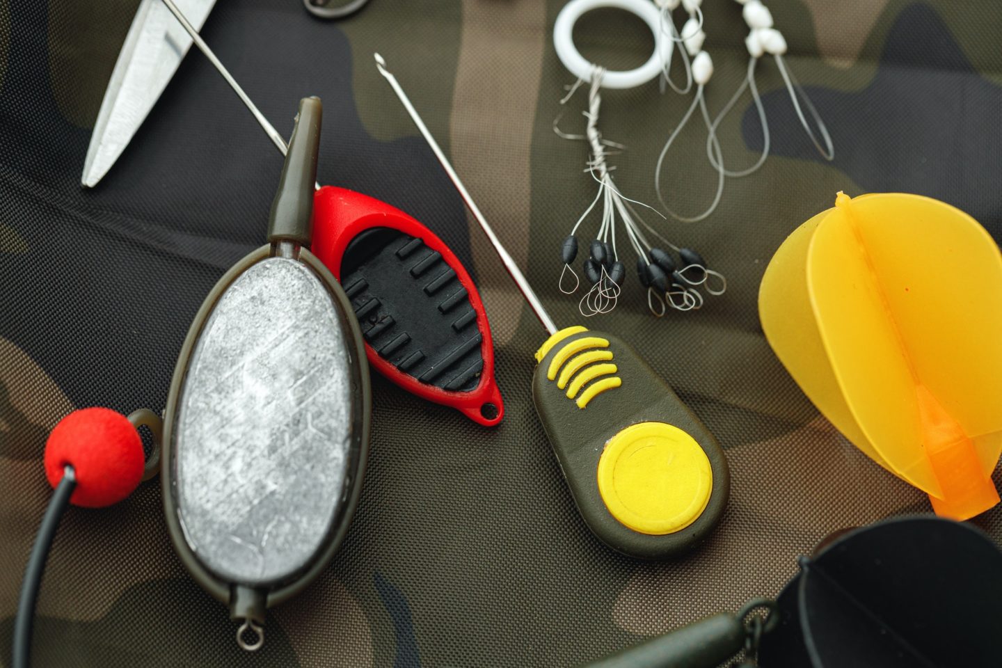 Fishing gear on wooden background close up