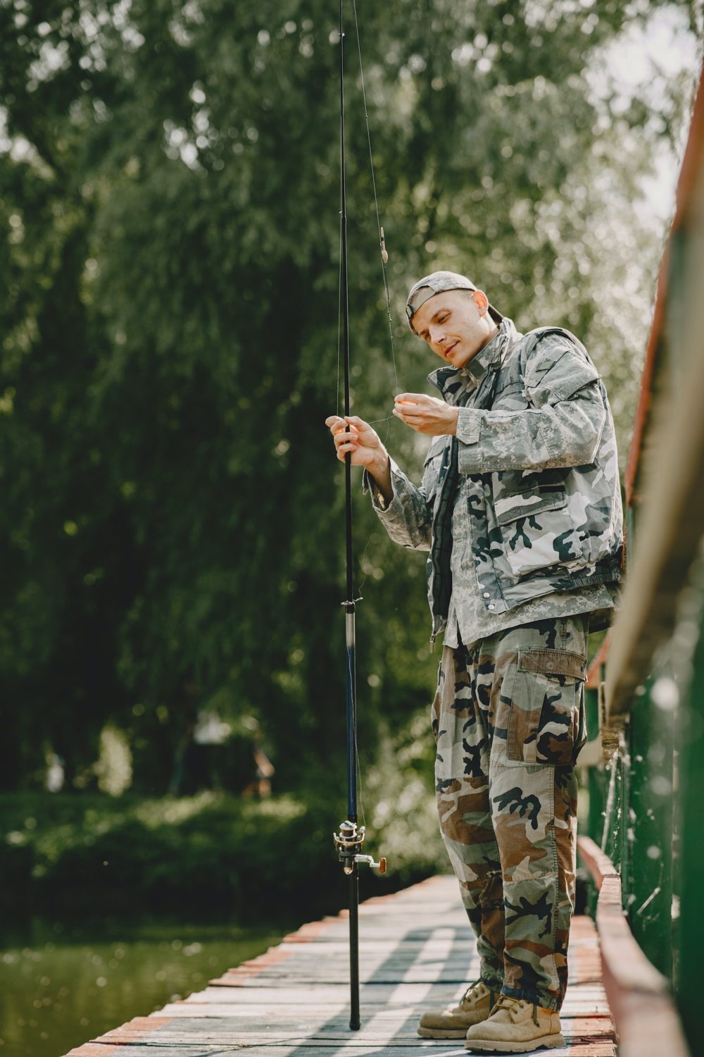 Man fishing and holds the angling rod
