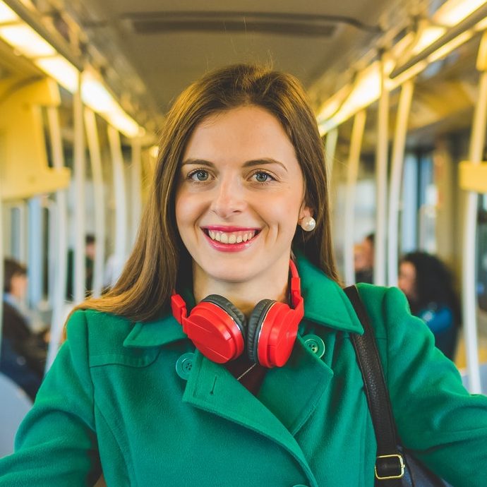 Young woman smiling posing travelling underground