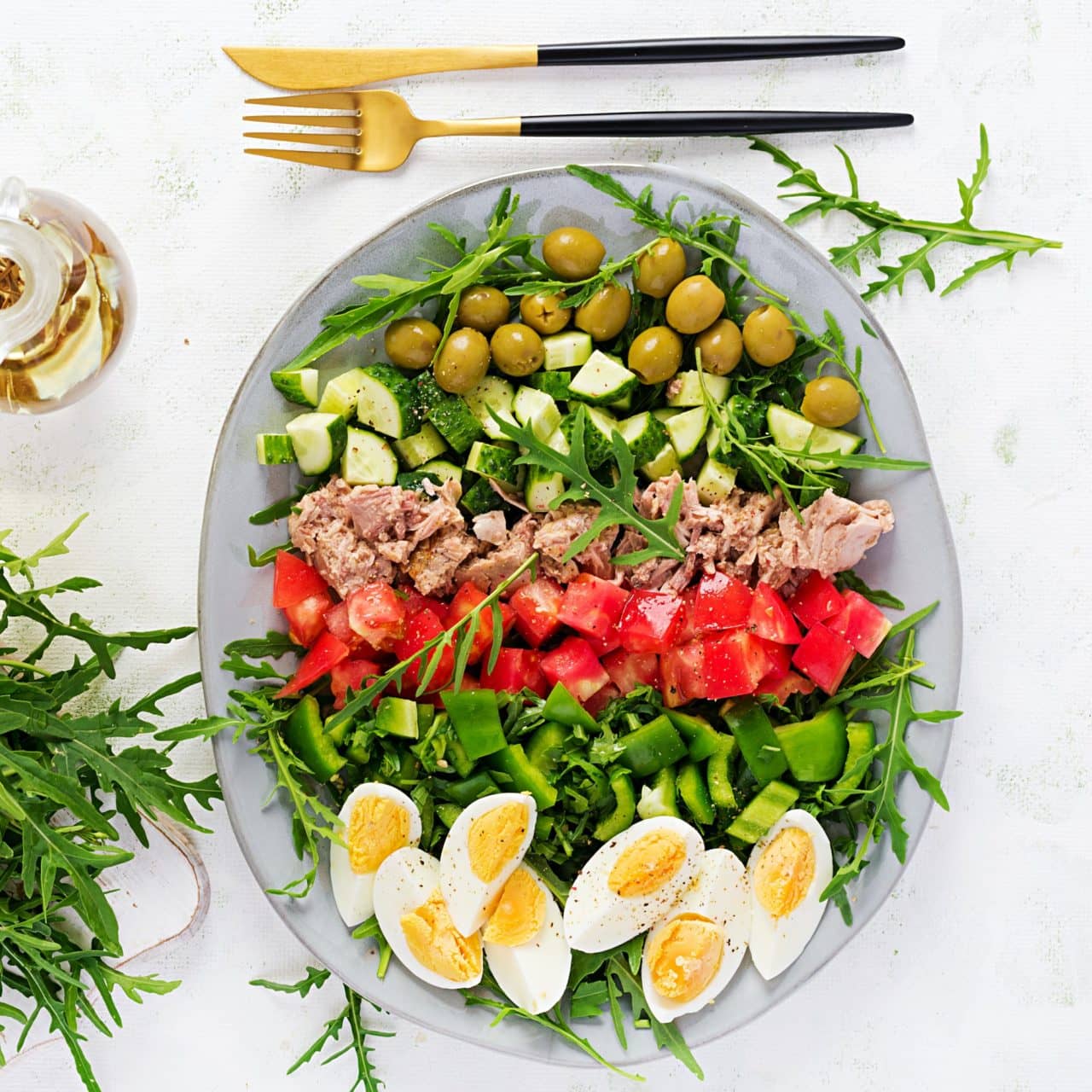 Healthy food. Tuna fish salad with eggs, cucumber, tomatoes, olives