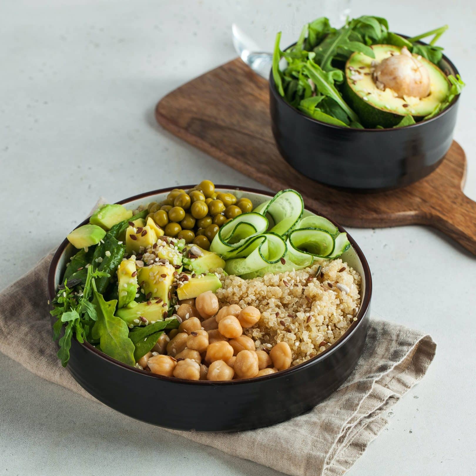 Healthy vegetable lunch from the Buddha bowl with quinoa, avocado, chickpeas.