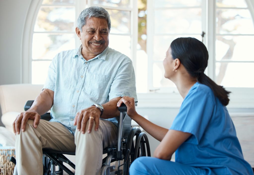 Cropped shot of a handsome senior man and his female nurse in the old age home