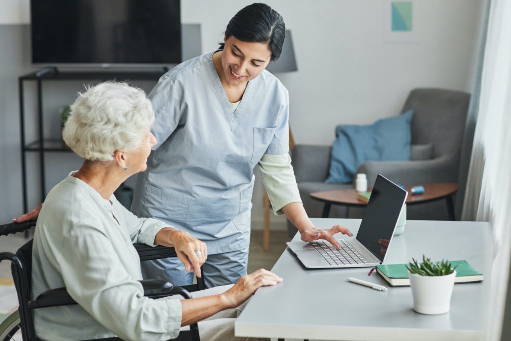 Nurse Assisting Senior Woman