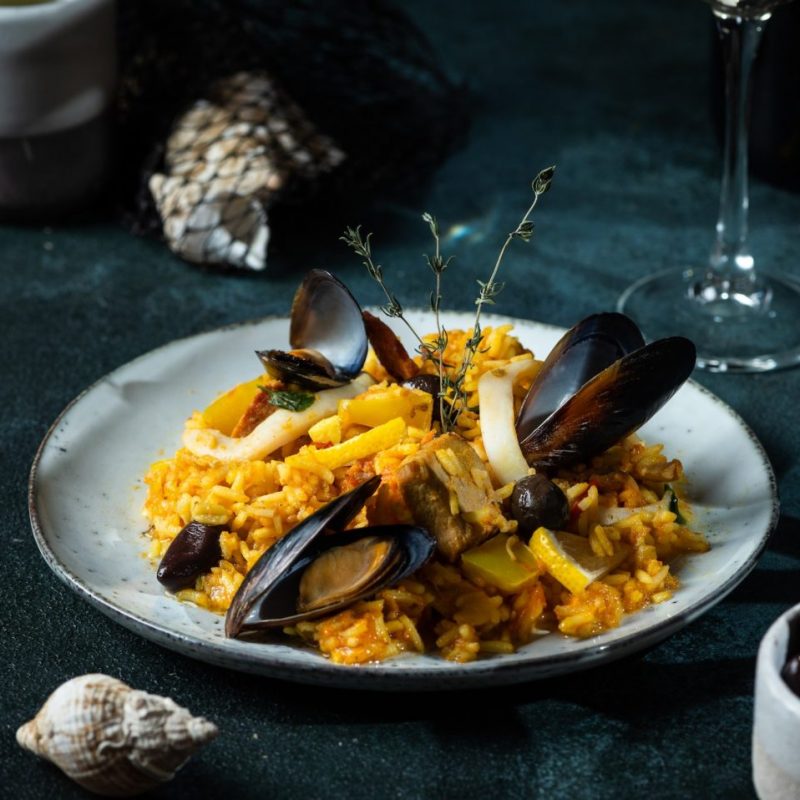Classic dish of Spain, seafood paella. Spanish paella with shrimps, clamps, mussels. mediterranean