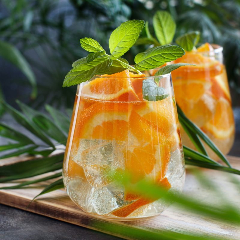 Homemade refreshing mocktail with soda and orange juice