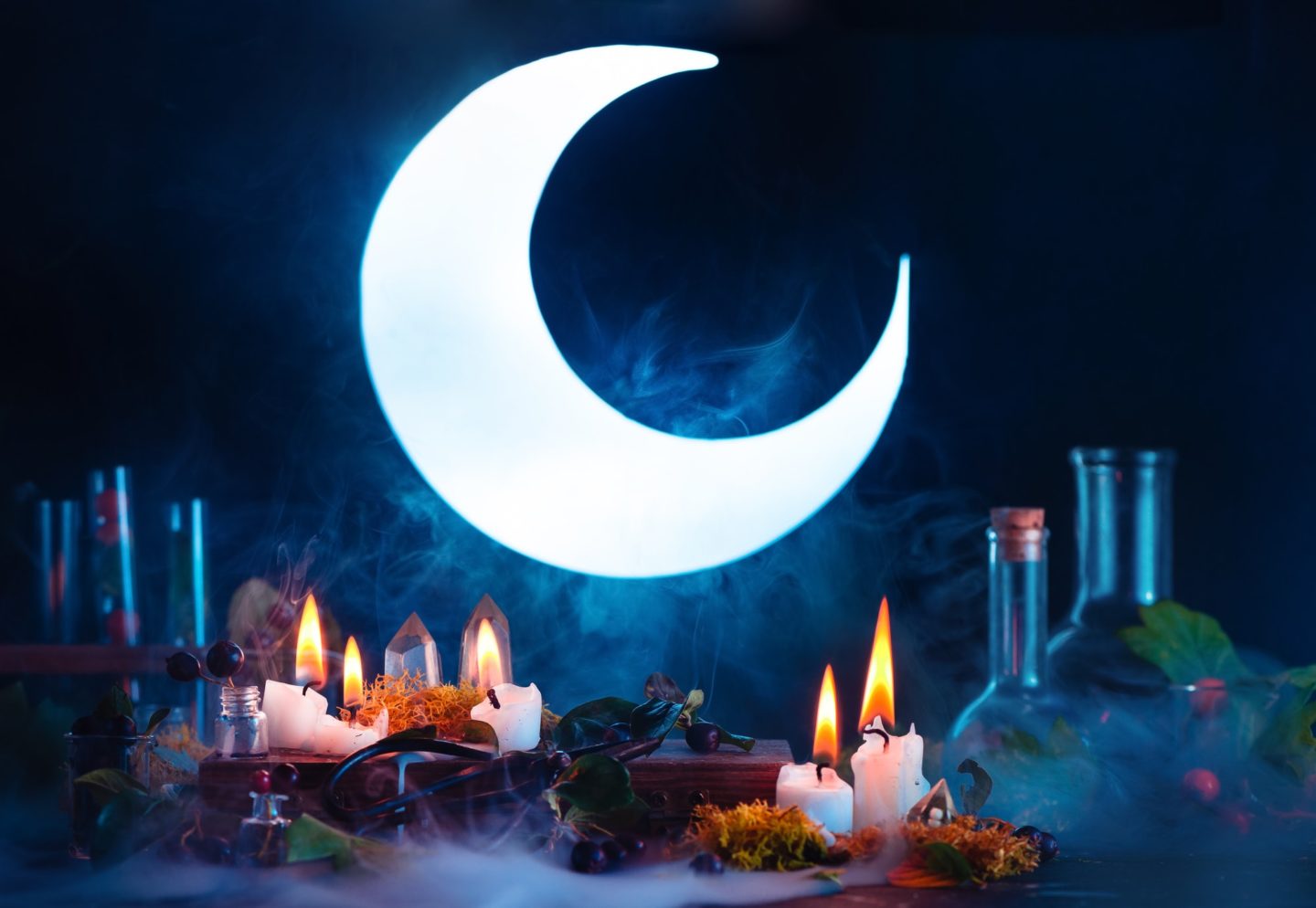 Halloween header with shining full Moon. Witch or wizard workplace with burning candles. Spooky
