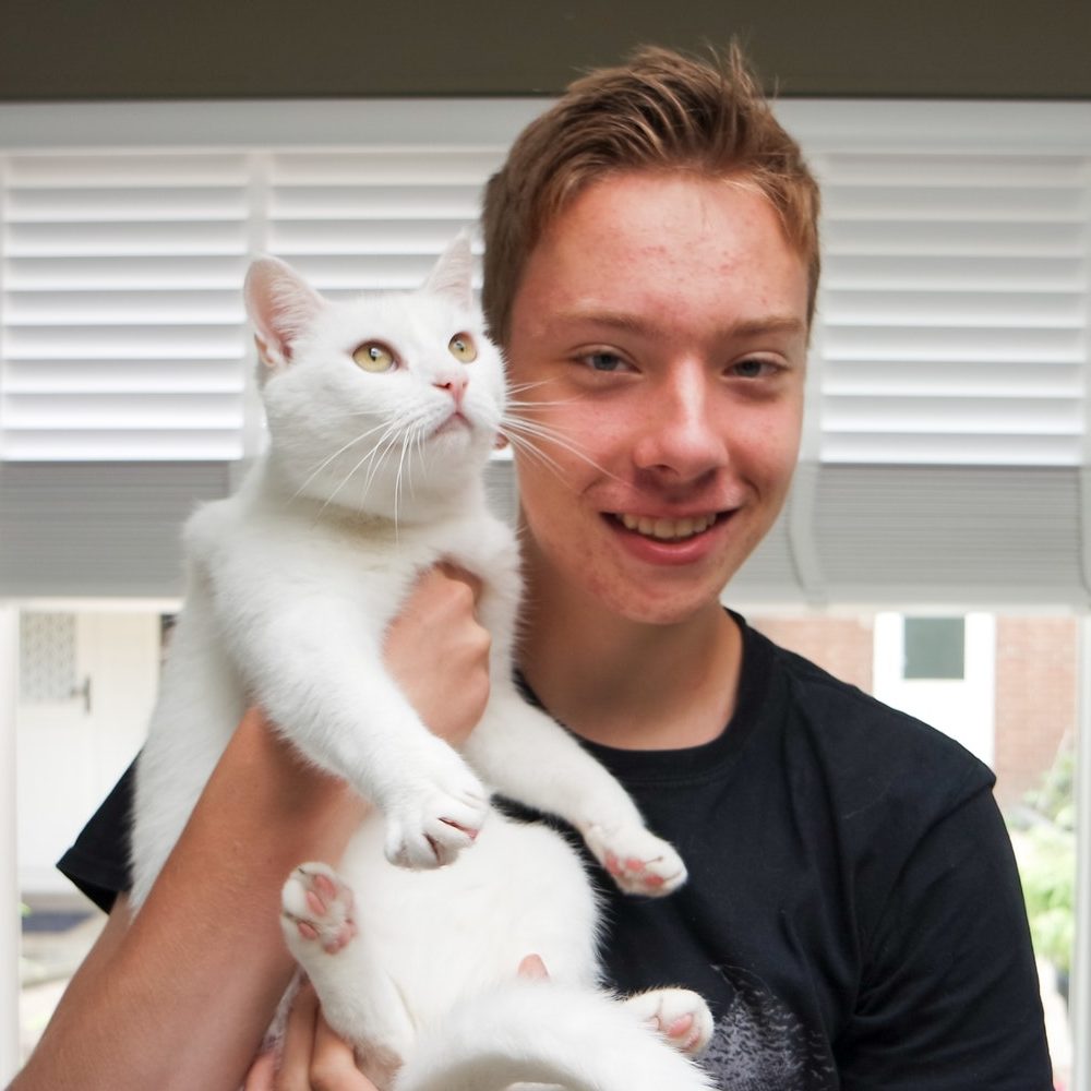 Young man with his lovely white cat. Nominated!??