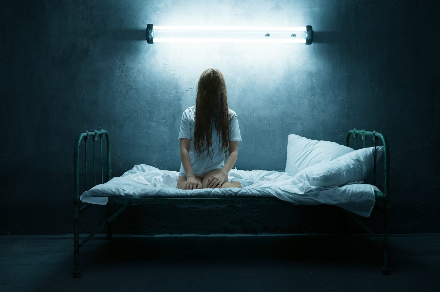 Psycho woman screams in bed, insomnia horror