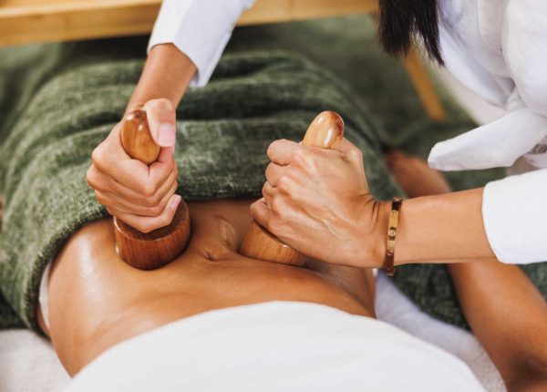 maderotherapy-massage-with-wooden-cup-in-a-spa-cen-PHFSKTJ