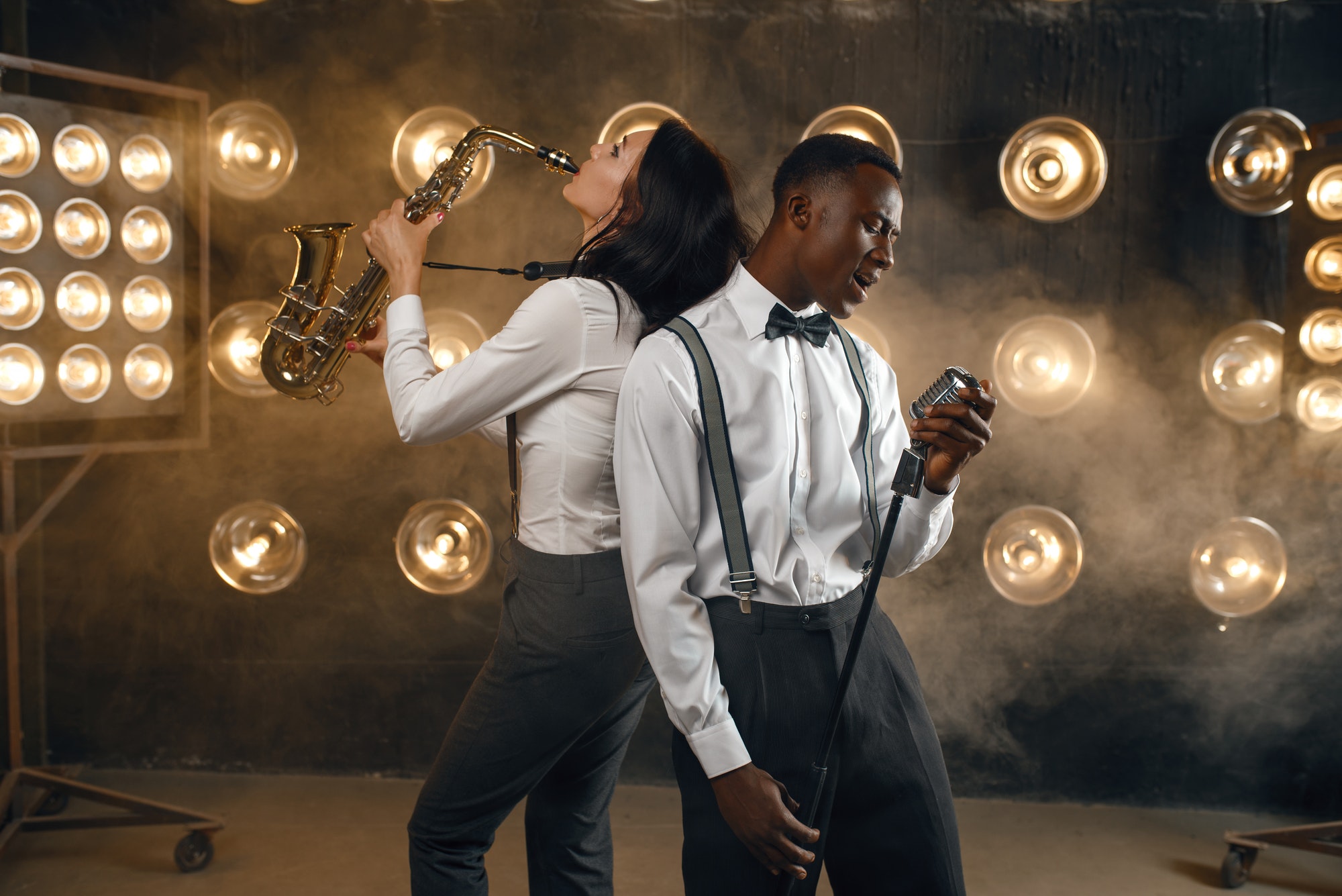 Male jazz performer and female saxophonist