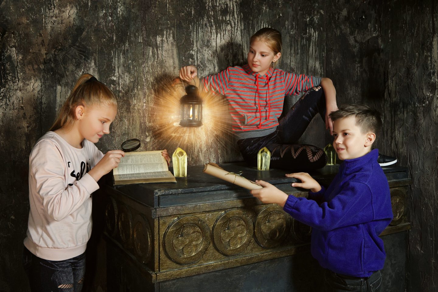 Three children in quest game solving a riddle