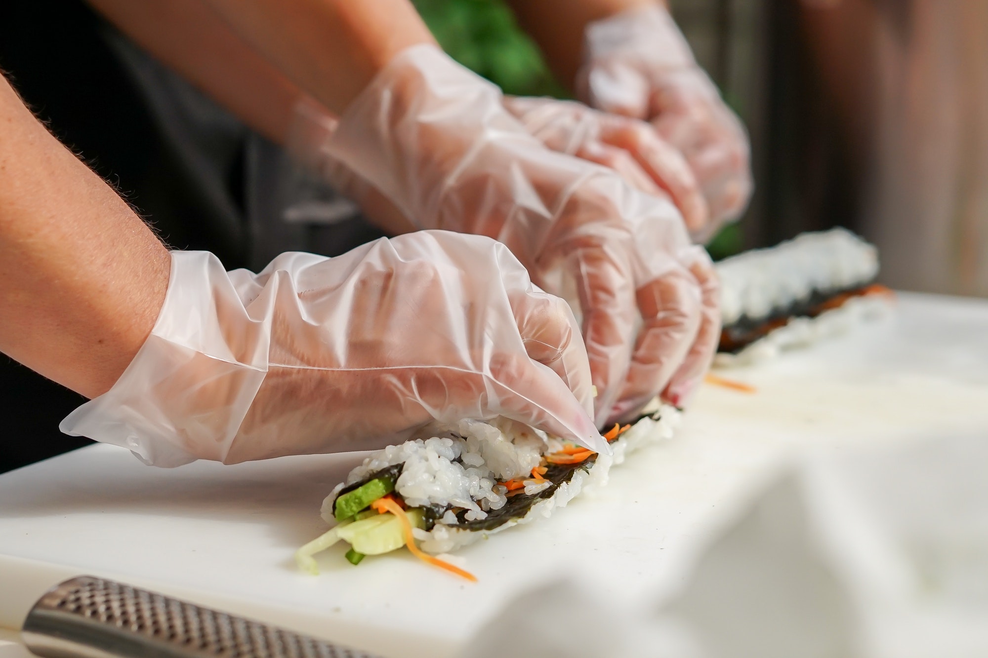 making sushi and rolling