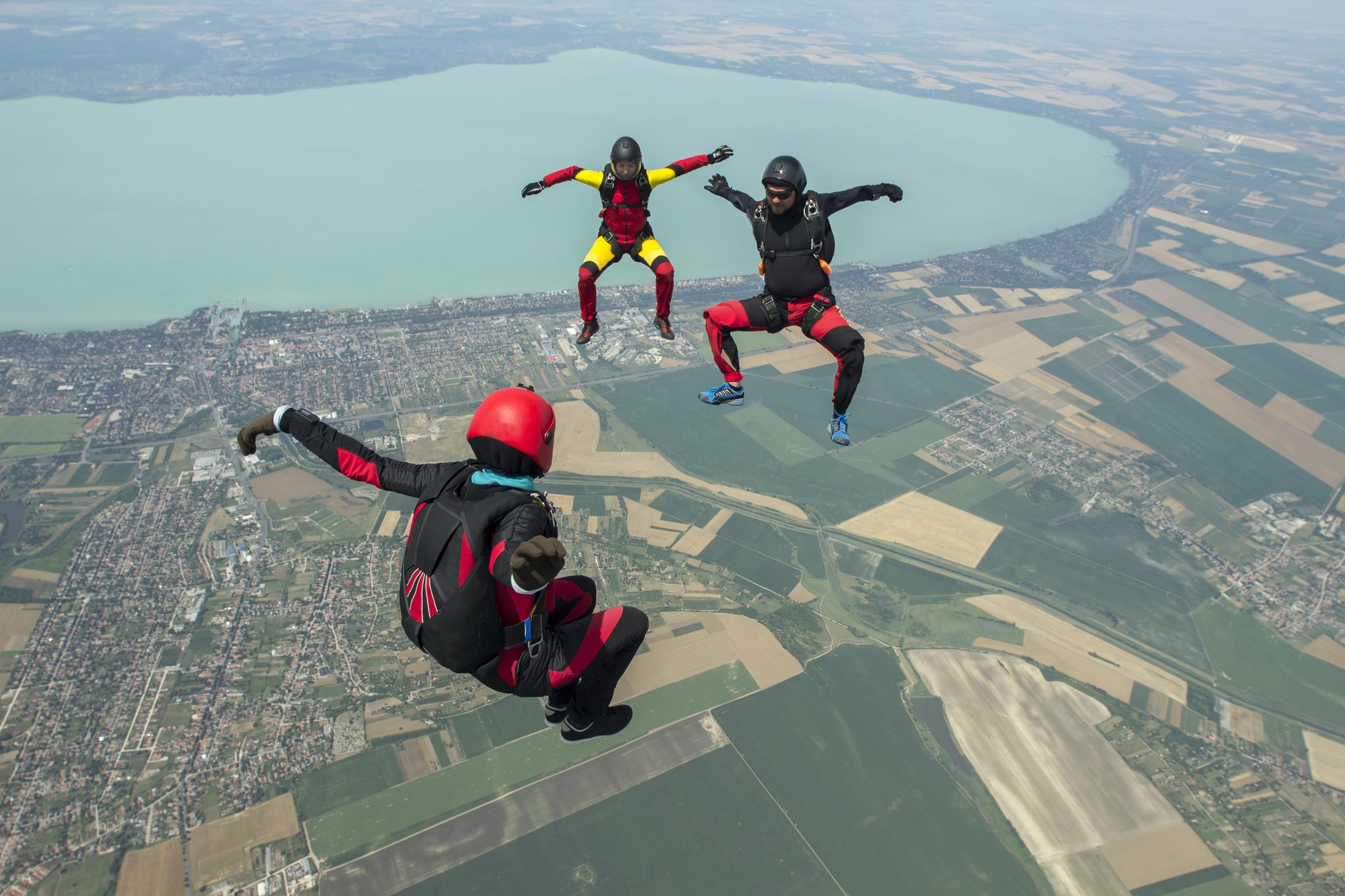 Three skydivers freeflying in formation, Siofok, Somogy, Hungary