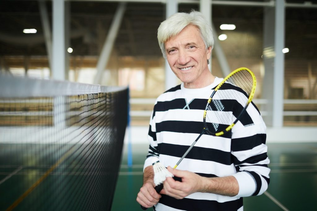 Aged badminton player