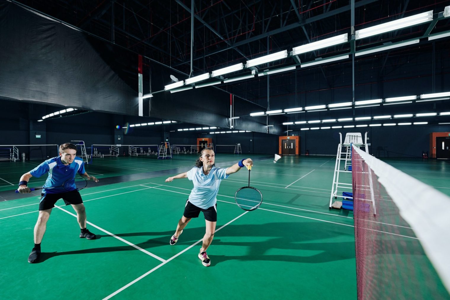 Mixed double playing badminton