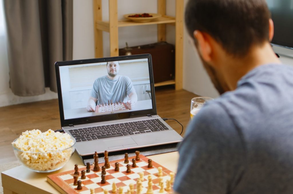 Friends playing chess on video call