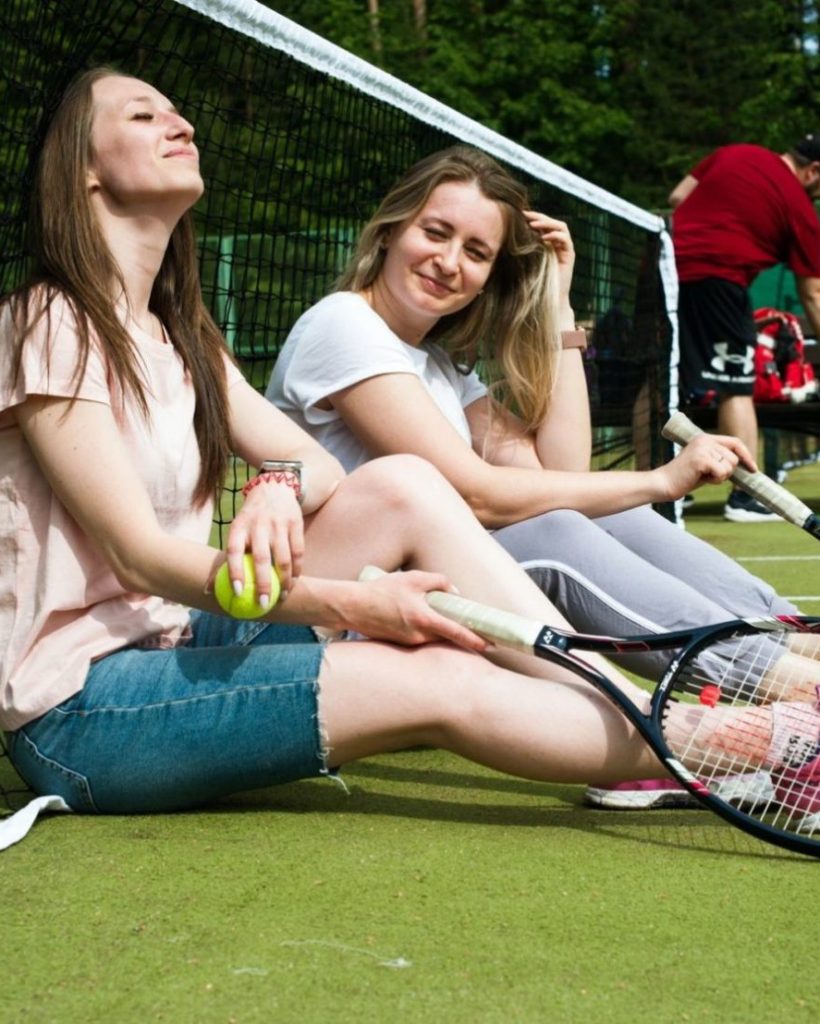 young girls playing tennis
