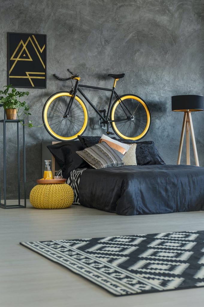 Grey student bedroom with bike
